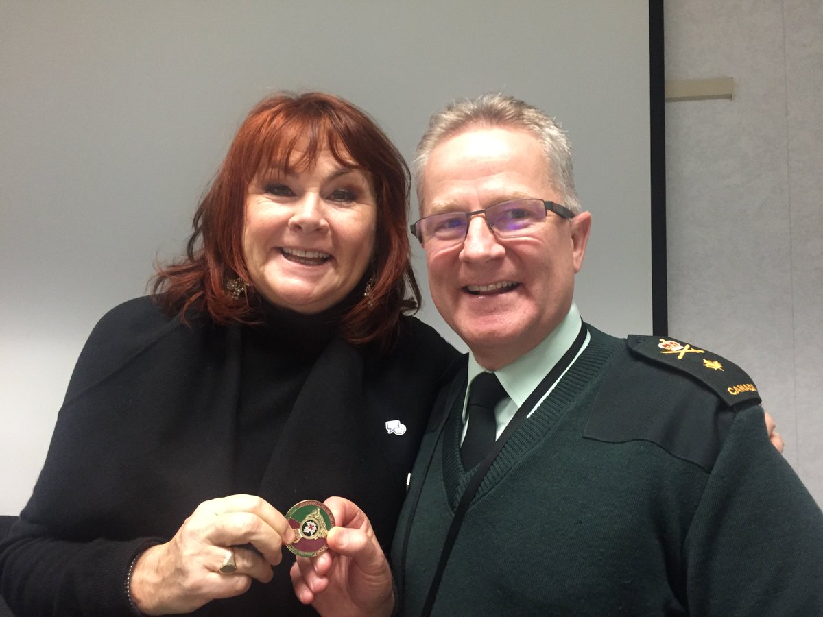 BGen MacKay presents Mary Walsh with the Surgeon General's coin for her continuing work on breaking down stigma. #BellLetsTalk
