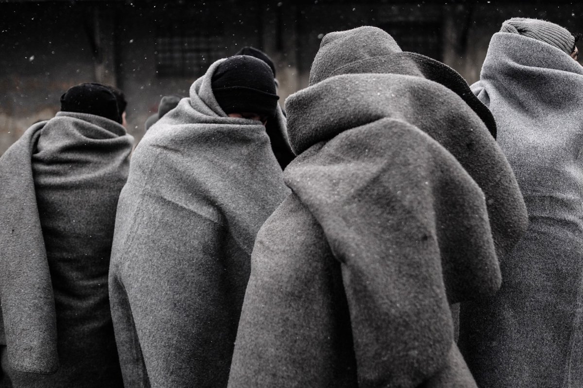 A group of yng Afghanis wait in the snow for food distribution at a makeshift refugee camp  #Belgrade #Refugees #refugeecrisis #Serbia