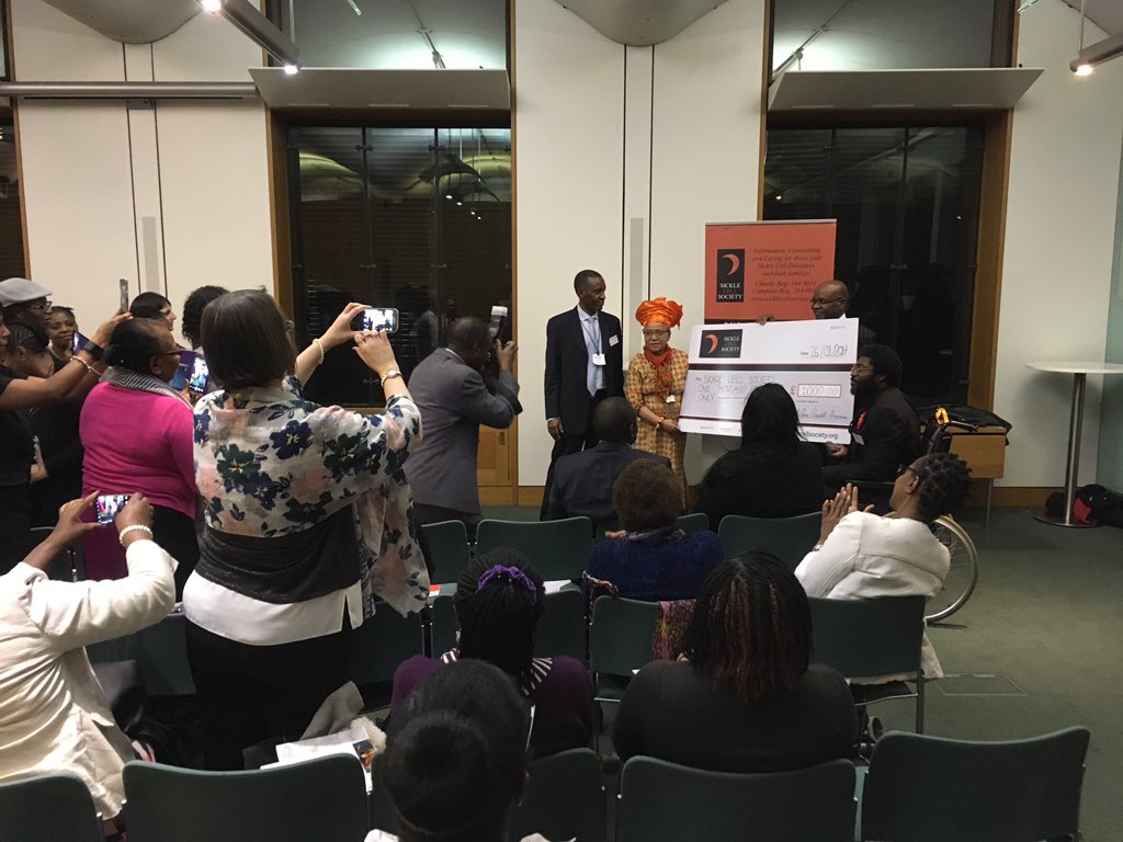 cbuk100's tweet photo. @SickleCellUK receiving a wonderful donation from @EAnionwu at the Parliamentary launch of her brilliant autobiography! @HouseofCommons https://t.co/EiO5KO2GAs