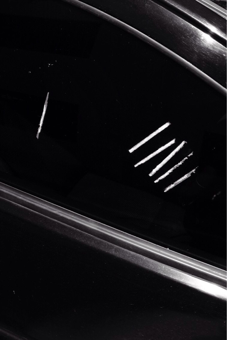 BonShepherd's tweet image. The remains of traffic tickets on a window. #abstractphotography