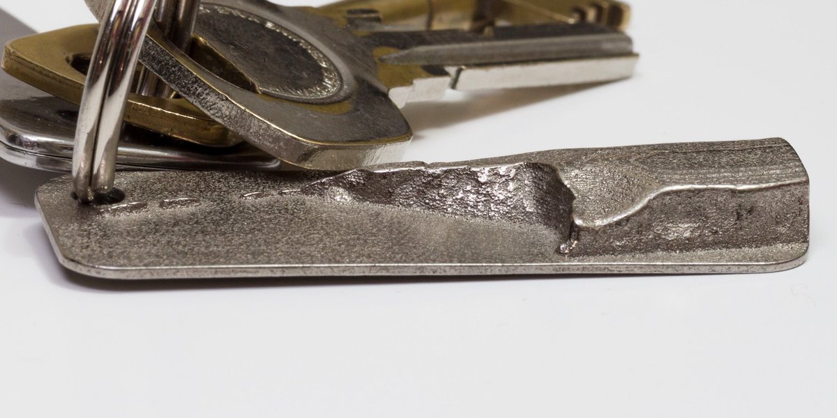 dt99jay's tweet photo. Two topographical keyrings: IoW's Needles &amp; Lulworth Cove. Made with #OpenData from @EnvAgencyGeomat &amp; printed in steel by @shapeways https://t.co/3gtzrpFUMN