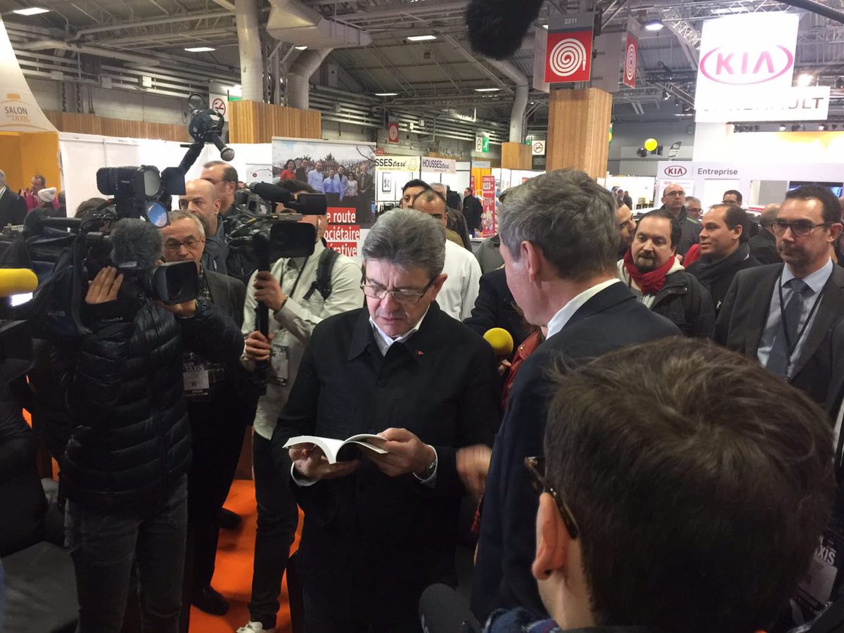 JLMelenchon's tweet photo. Rencontre au #SalonDesTaxis avec Laurent Lasne, auteur de « Uber, la prédation en bande organisée ». https://t.co/G6tqCVOrRG