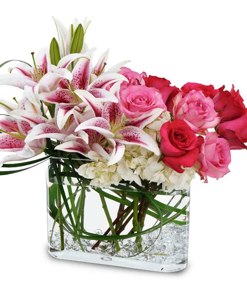 Make this Valentine's Day memorable with a gorgeous design of fragrant stargazer lilies, pink and red roses, and white hydrangea.