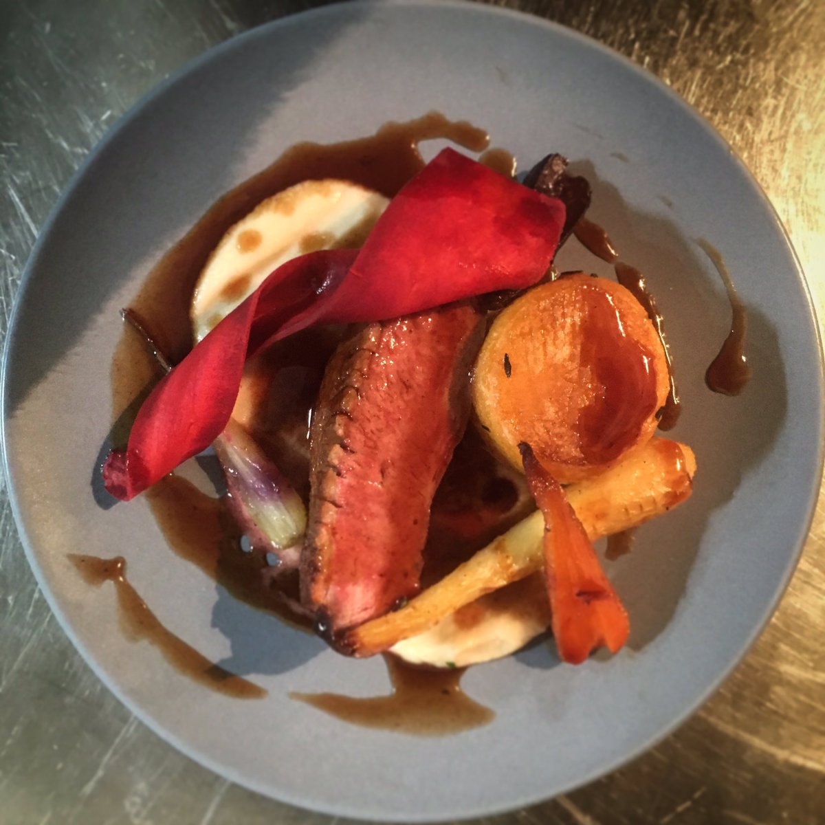 Medium rare duck breast, turnip fondant, chantenay carrots, piccolo parsnips, celeriac purée and jus