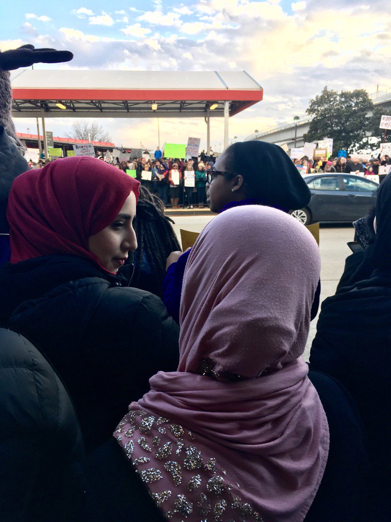 The crowd at Atlanta's arrivals gate has spilled across the drop off zone &amp; begun constricting traffic  #NoBanNoWall