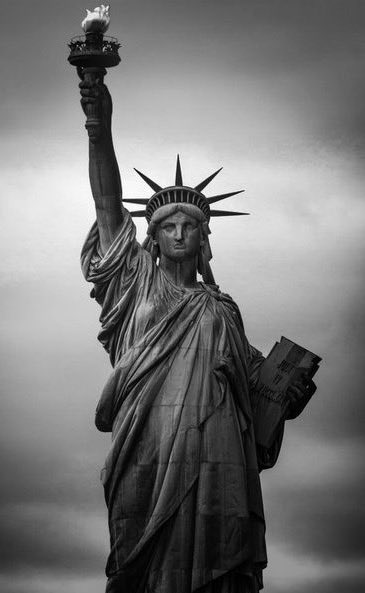 ... the homeless, tempest-tossed, to me: I lift my lamp beside the golden door.