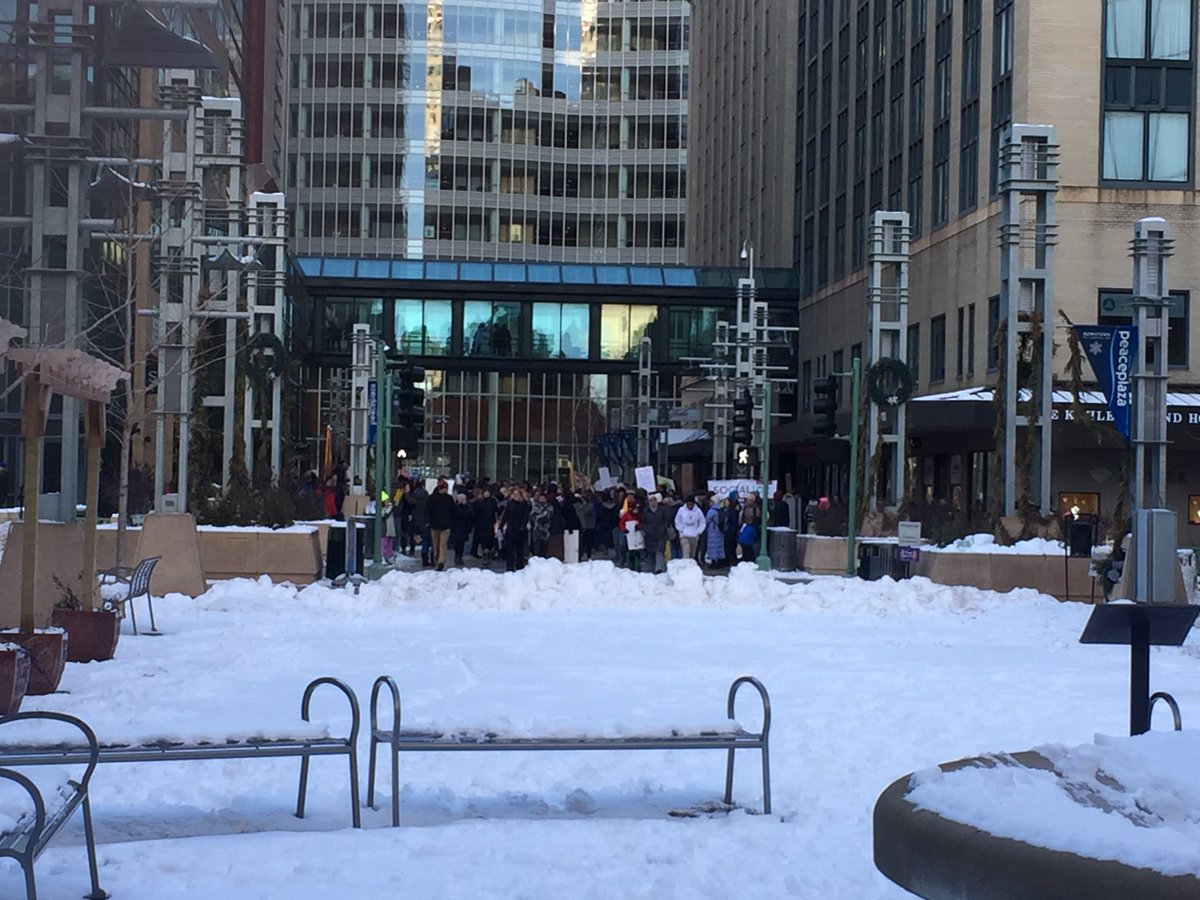 Janecf's tweet image. Protest happing in downtown Rochester, Minnesota! #resist #ResistTrump #muslimban