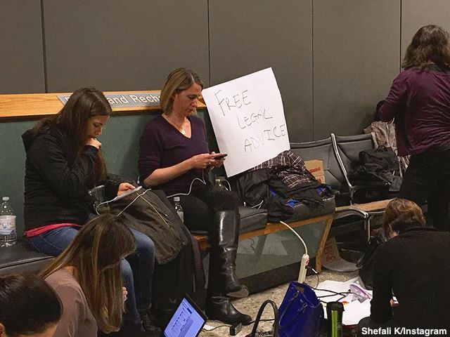 ABCPolitics's tweet photo. "Here to help": Lawyers hold signs at airports from DC to Los Angeles offering assistance to detained passengers https://t.co/19batwz8Ci https://t.co/eAD5ZKbcNL