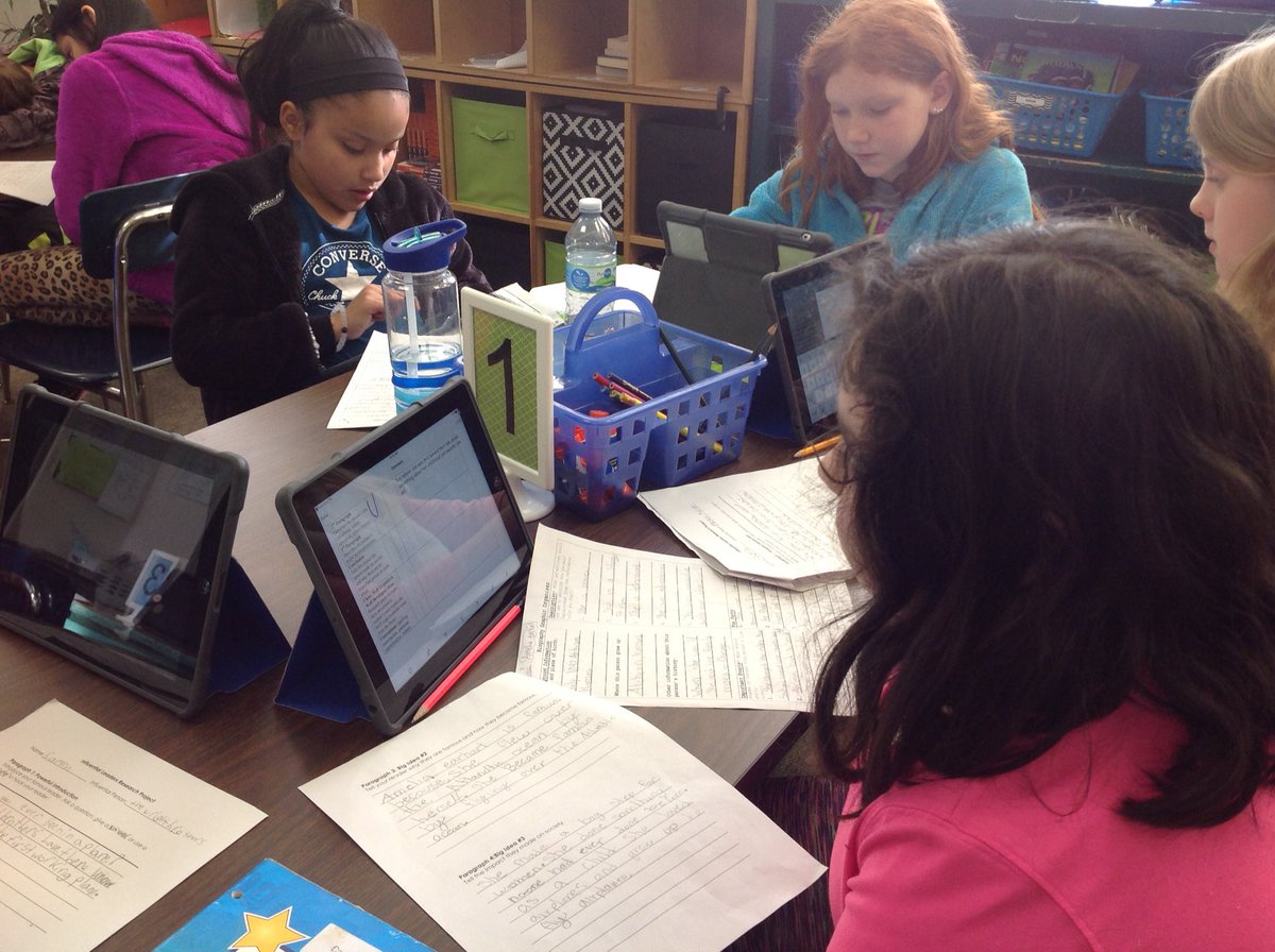 Students doing a great job peer editing each other's biography reports!