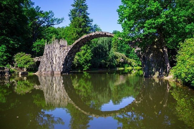 RoutesTips's tweet photo. Nastled among the verdant foliage in Kromlau, is the Rakotzbrucke, also known as the devil… https://t.co/0mKHVSTAMR https://t.co/3X9U9JkMMV