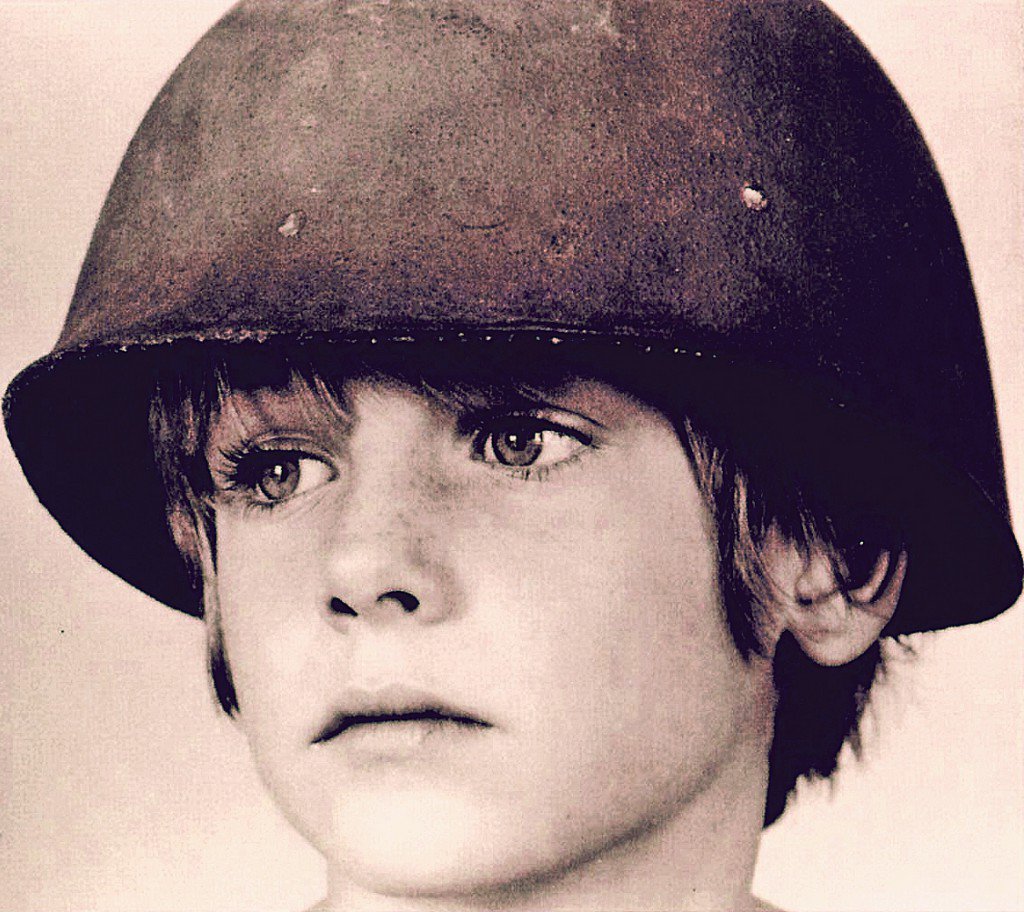 And it's true we are immune
When fact is fiction and TV reality
And today the millions cry
We eat and drink while tomorrow they die #WAR #U2