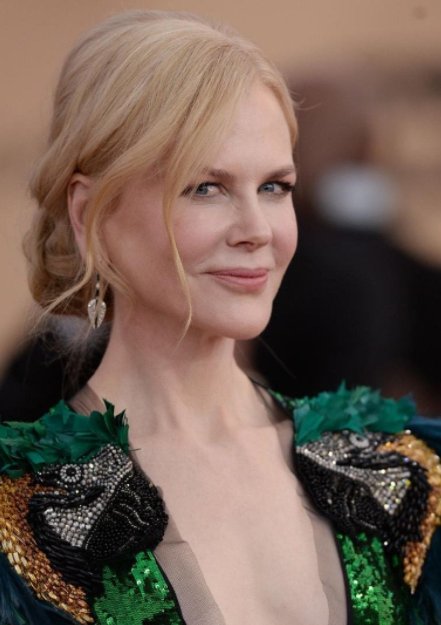 Nicole's dress is a total crowd divider... but we think her hair is romantic updo perfection!