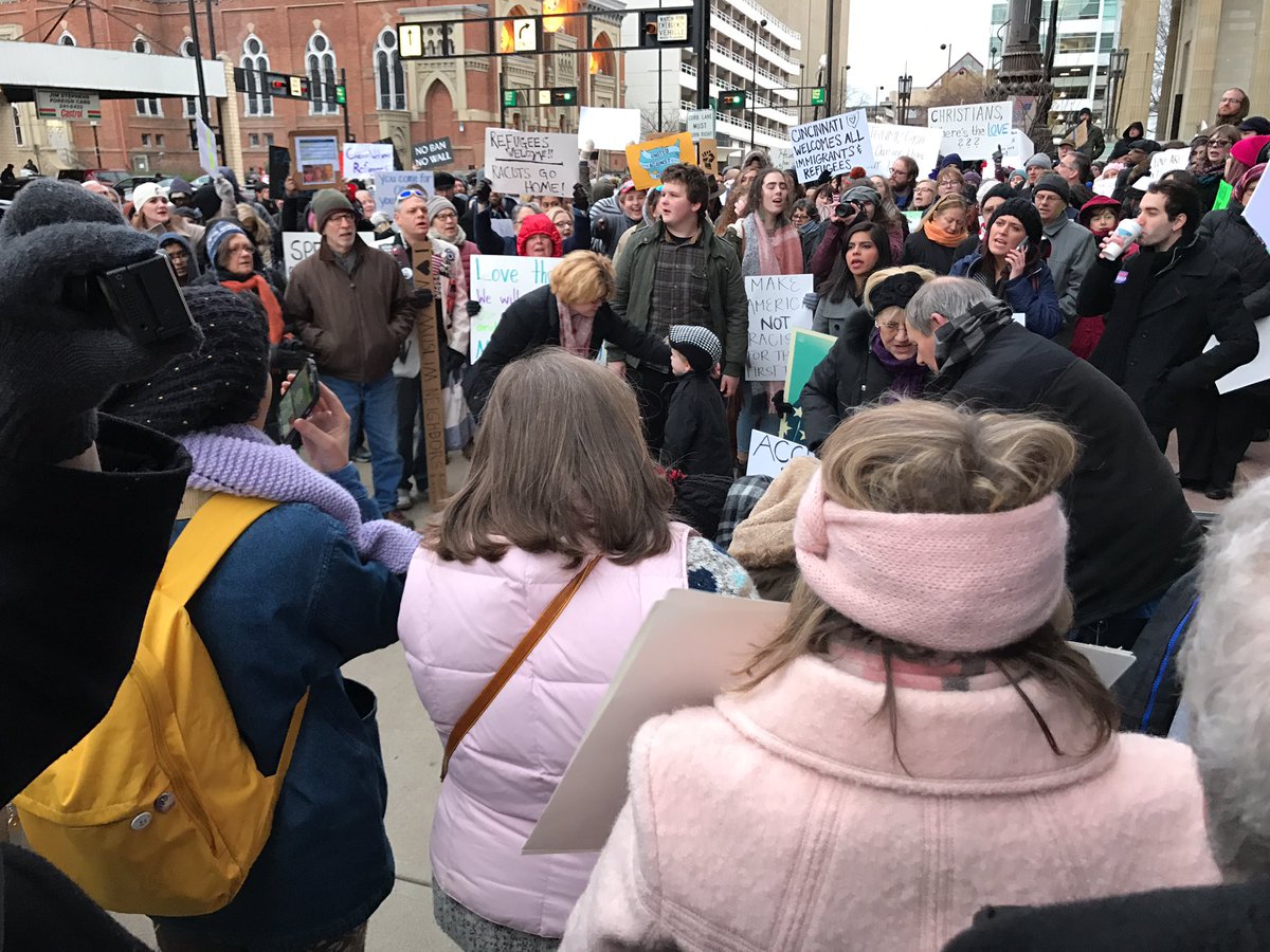 derekbauman's tweet photo. Crowd growing at Cincinnati rally for refugees. #SanctuaryCity https://t.co/erKc8D4wZj