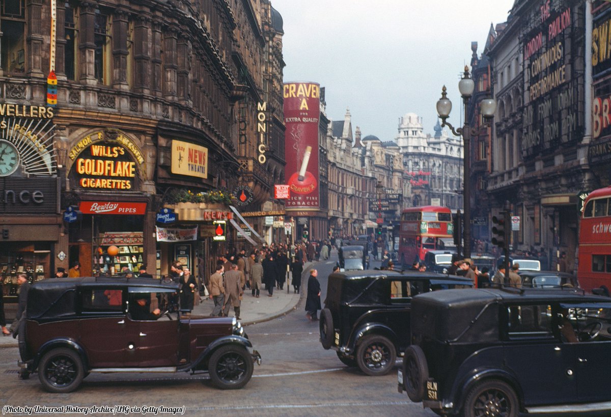 HistoryInPics's tweet image. Color photograph of Shaftesbury Avenue from Piccadilly Circus, London,  1940.