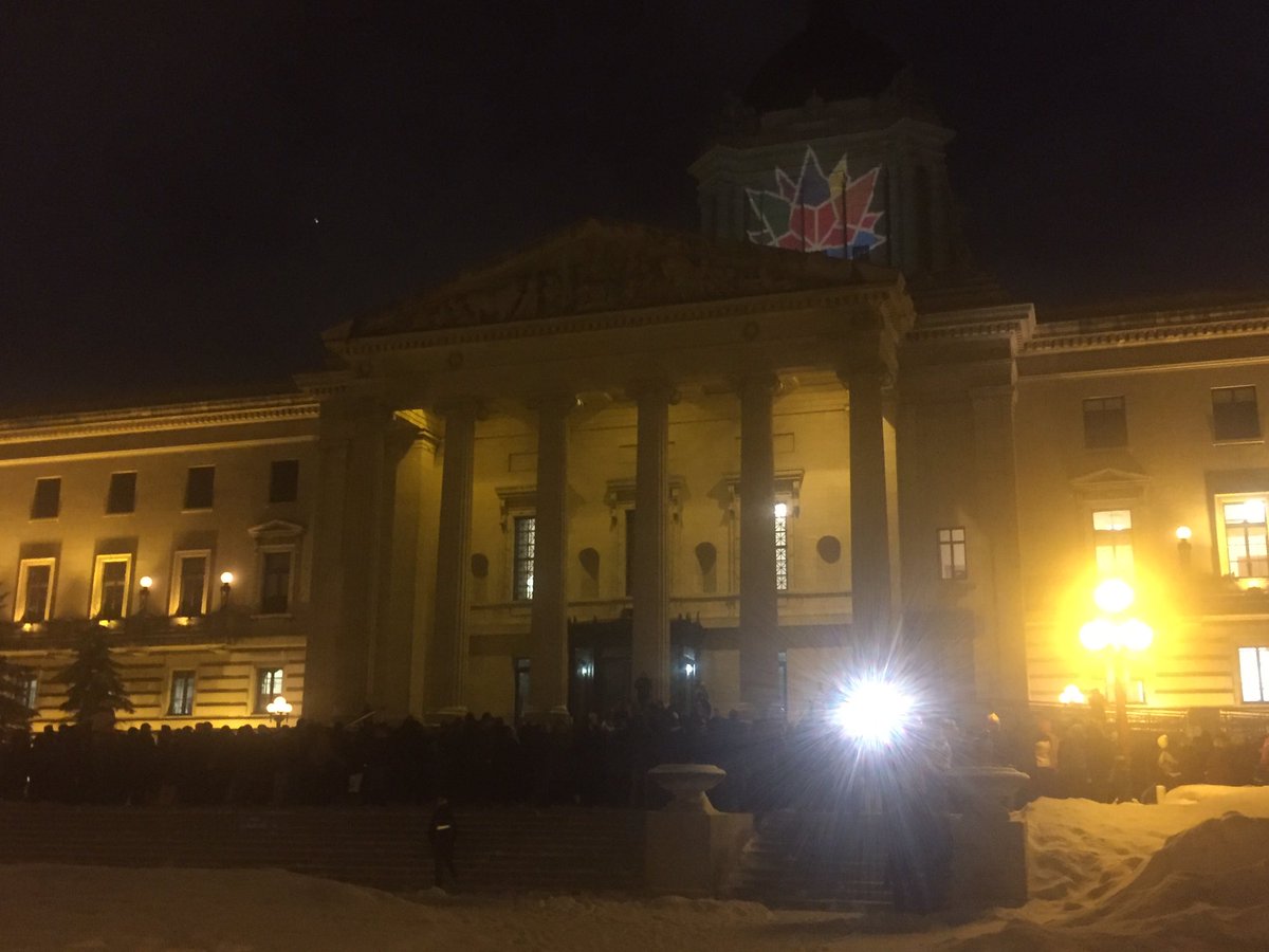Vigil in support of #quebecshooting victims as #Canada150 logo projected on #manitoba legislature. #cbcmb <a href="/CBCTheNational/">CBC News: The National</a> <a href="/CBCNews/">CBC News</a>