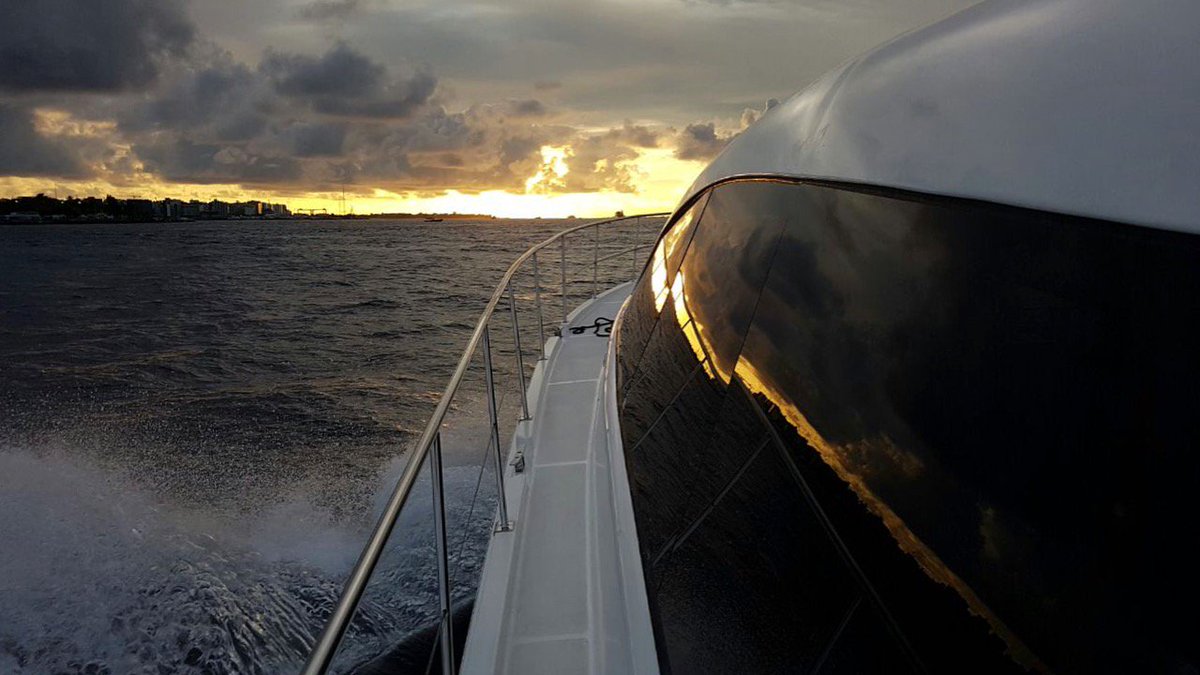 SeaShuttleIntl's tweet photo. A reflection of the golden sunset and horizon on the SeaShuttle window. https://t.co/WmFltNZHOf