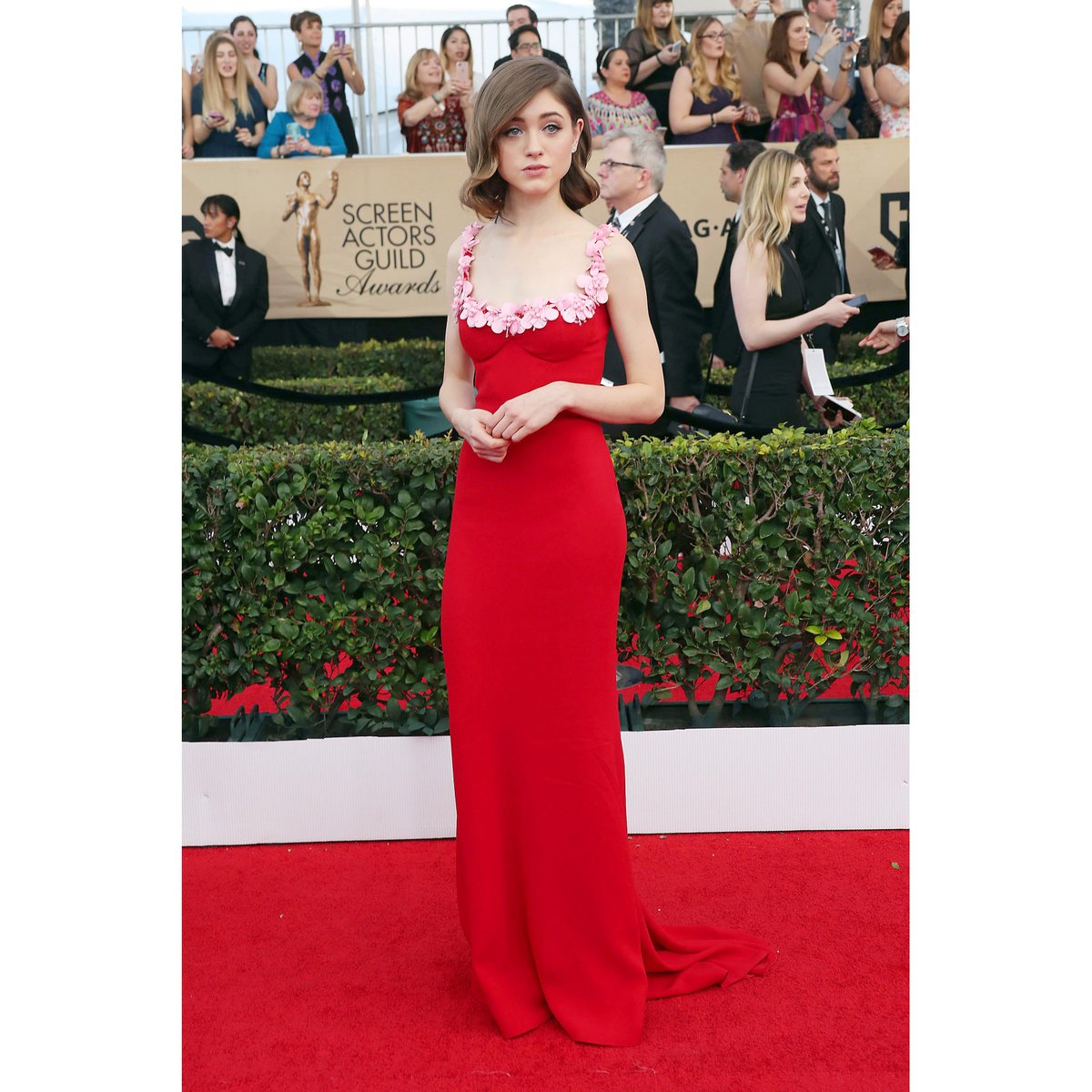 Stranger Things actress Natalia Dyer is a vision in a beautiful red Miu Miu silk-sable gown. Congratulations on your win! | #SAGAwards