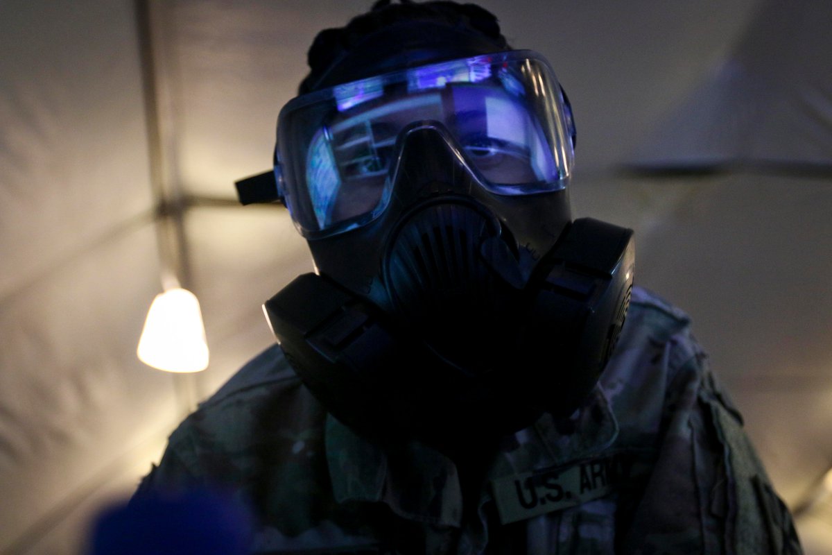 69thADA's tweet photo. An air defense #Soldier keeps a close eye on a wall of monitors during an exercise while in MOPP gear! @FORSCOM @usarmycentral @forthood https://t.co/H2yD9ttyqr