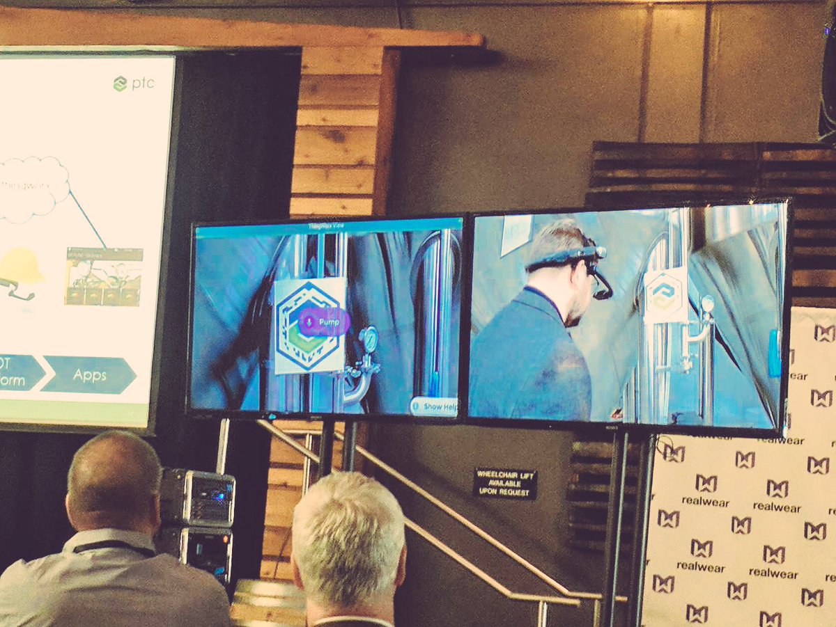 PTC's tweet photo. PTC's Glen Fields up on stage at #RWSummit! With #AR, #IoT &amp; @realwearinc's HM-1 headset, workers can access visual instructions and data. https://t.co/XkohyEfY0r