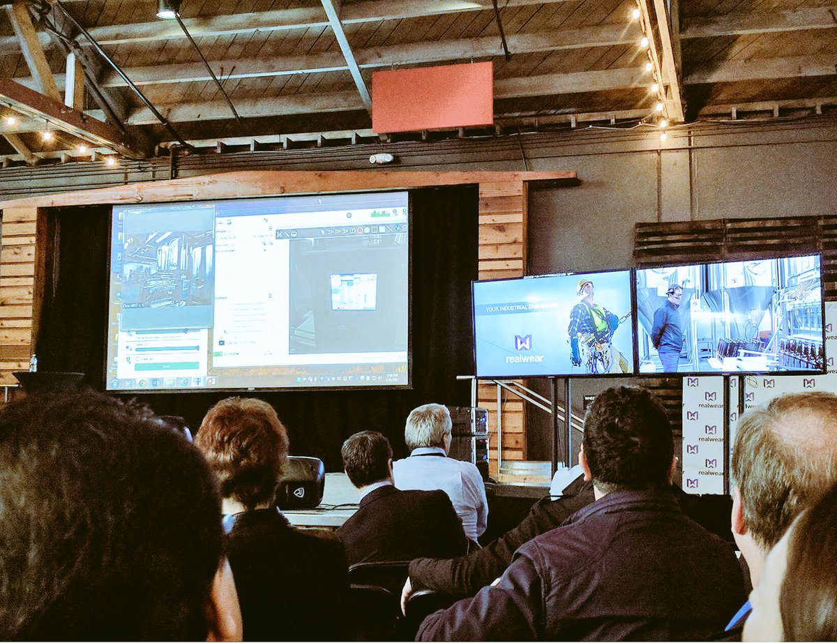 PTC's tweet photo. PTC's Glen Fields up on stage at #RWSummit! With #AR, #IoT &amp; @realwearinc's HM-1 headset, workers can access visual instructions and data. https://t.co/XkohyEfY0r