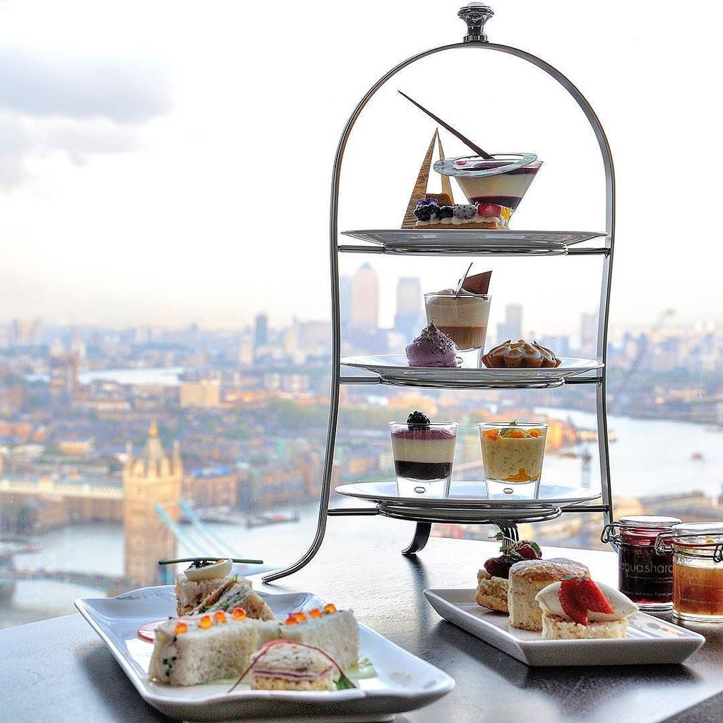 hellomkcom's tweet photo. A very British tradition, #afternoontea, we're enjoying it at #aquashard looking out over … https://t.co/DjzKpIuJUl https://t.co/TtYIZo0kEb