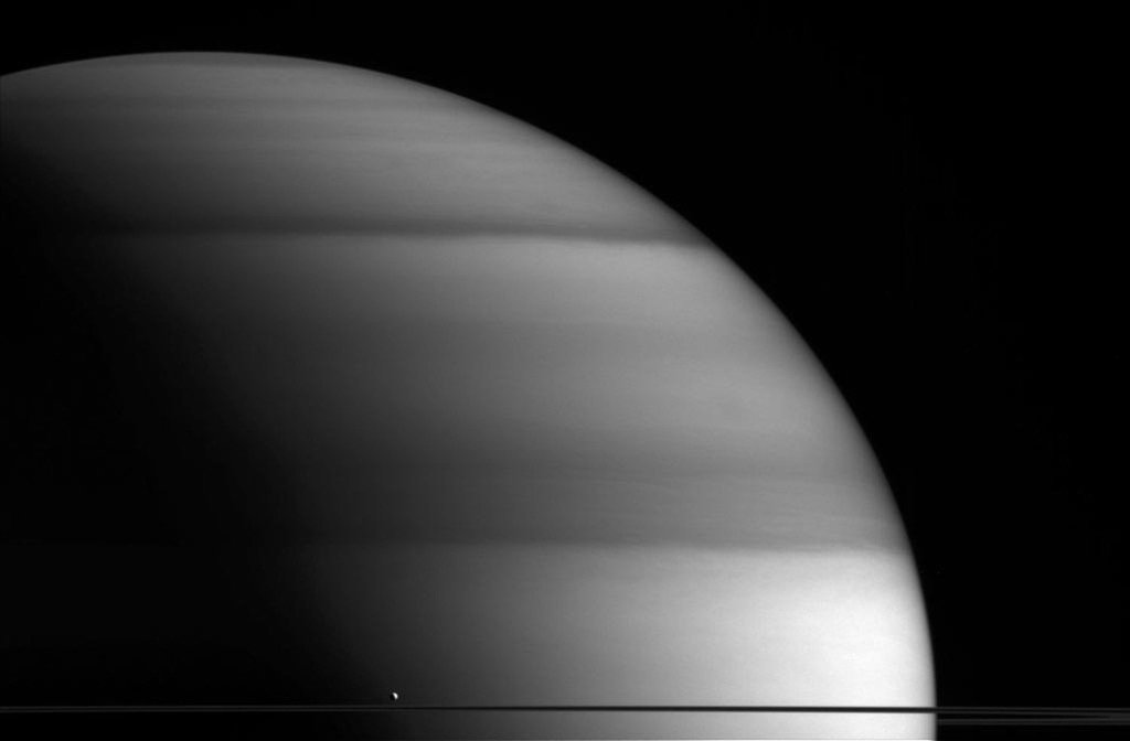 Space_Scene's tweet image. Saturn's moon Enceladus appearing dwarfed in front of the massive gas planet.#space #astronomy #saturn
