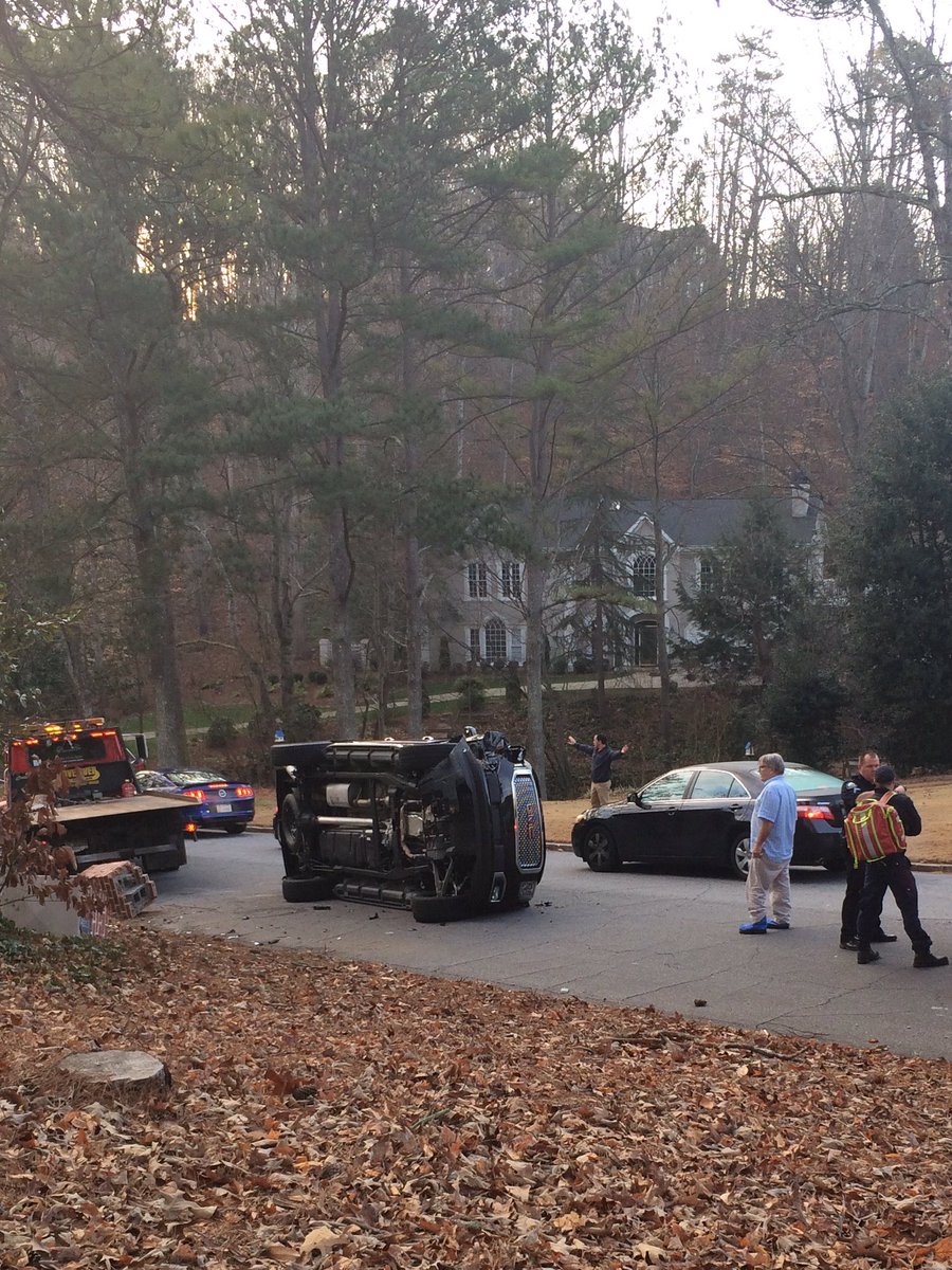 OurBrookfield's tweet photo. A black GMC Yukon has flipped over after hitting a mailbox in Oakhaven. Pls be careful out there! H/T pic - Rachel Howes https://t.co/rqdWIGKL6Y