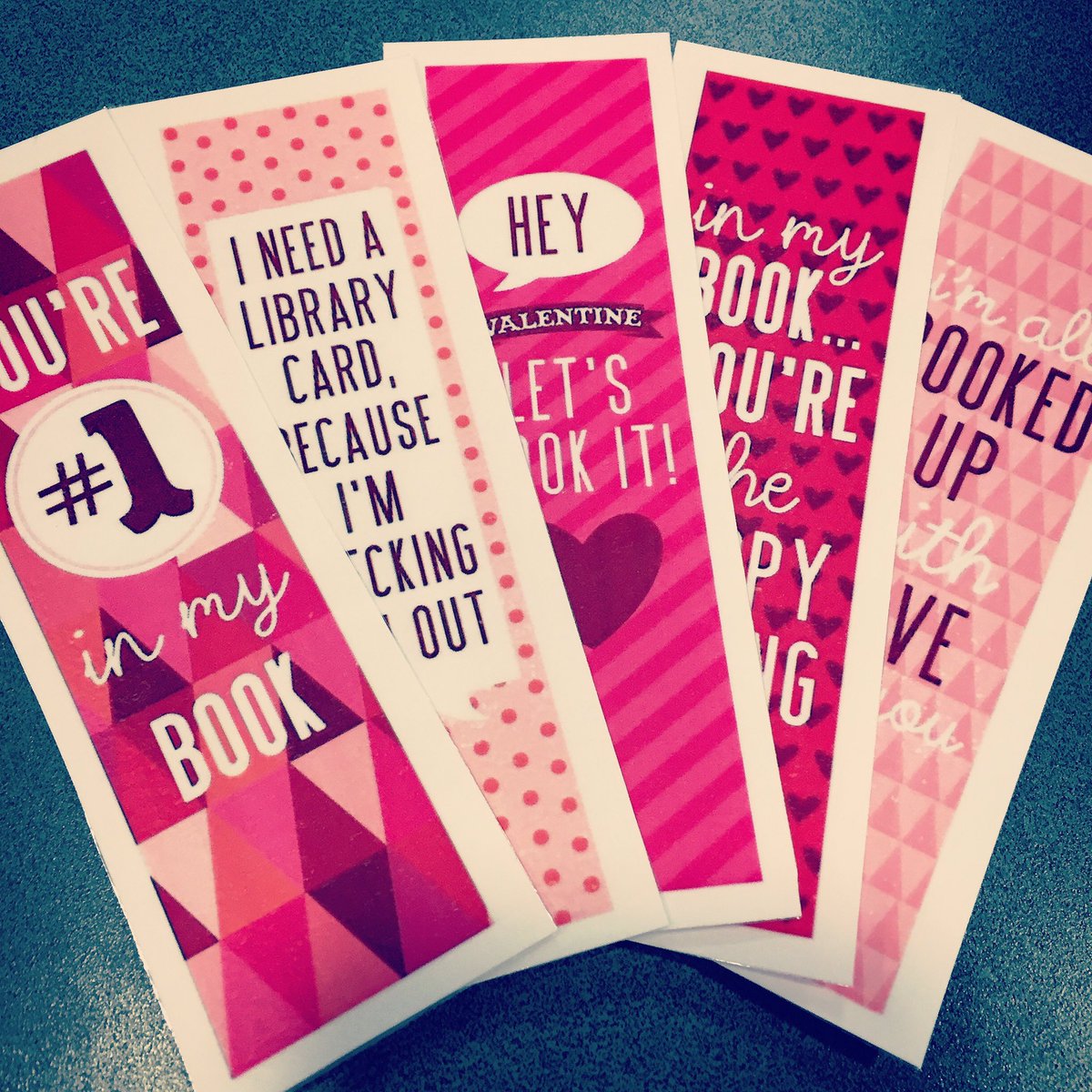 Not just any new bookmarks, pun-filled Valentine's Day bookmarks. They'd LOVE to hold your spot.