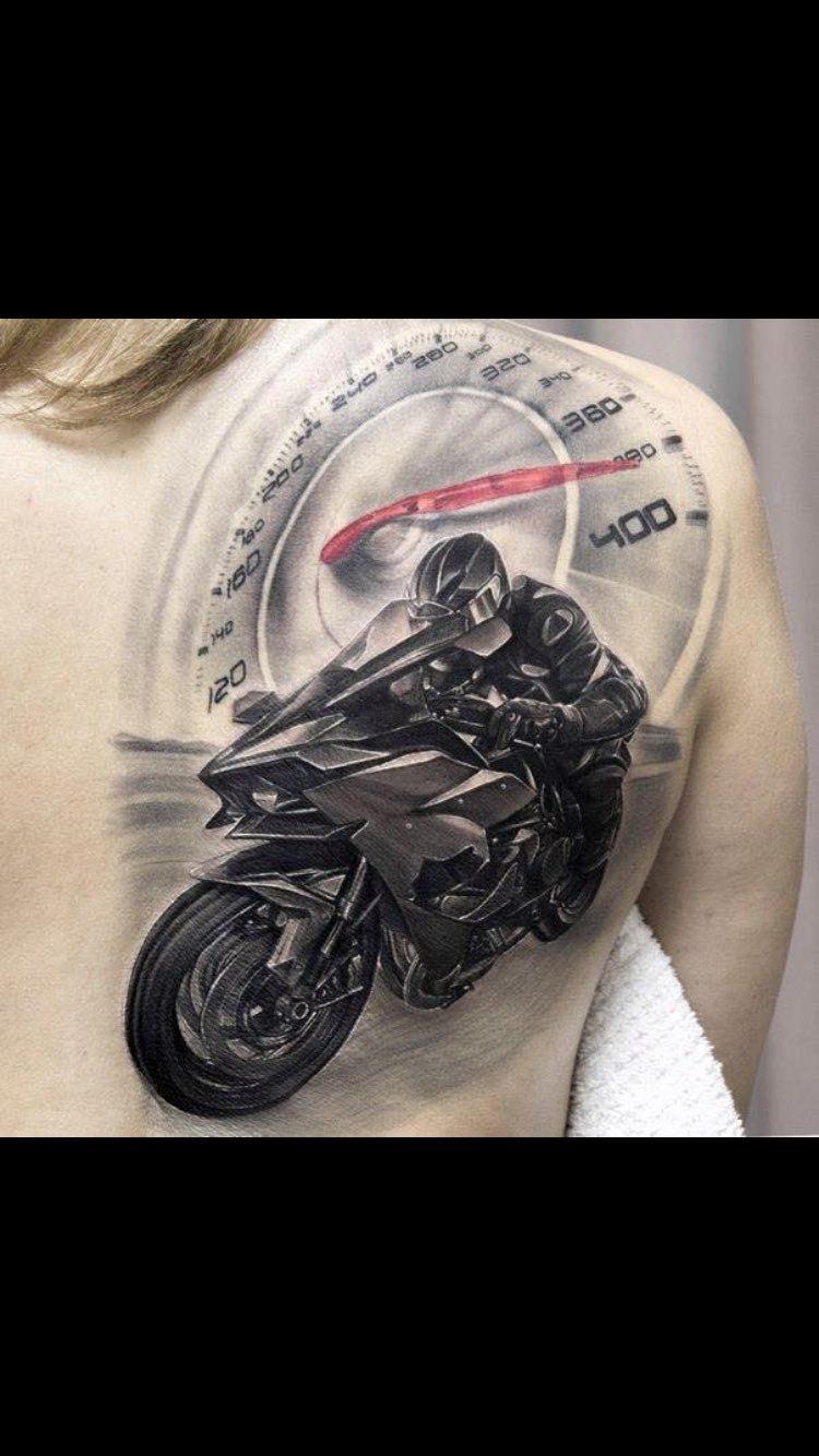 Traditional style motorbike tattoo on the inner arm.