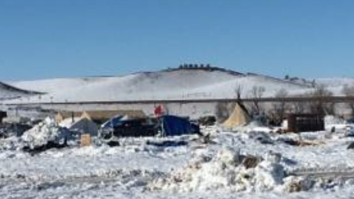 joshfoxfilm's tweet photo. #standingrock still needs your help.  New camp raided. Where once there were Tipis on the hill, now there are military vehicles. #nodapl https://t.co/eJnFmIY0j2