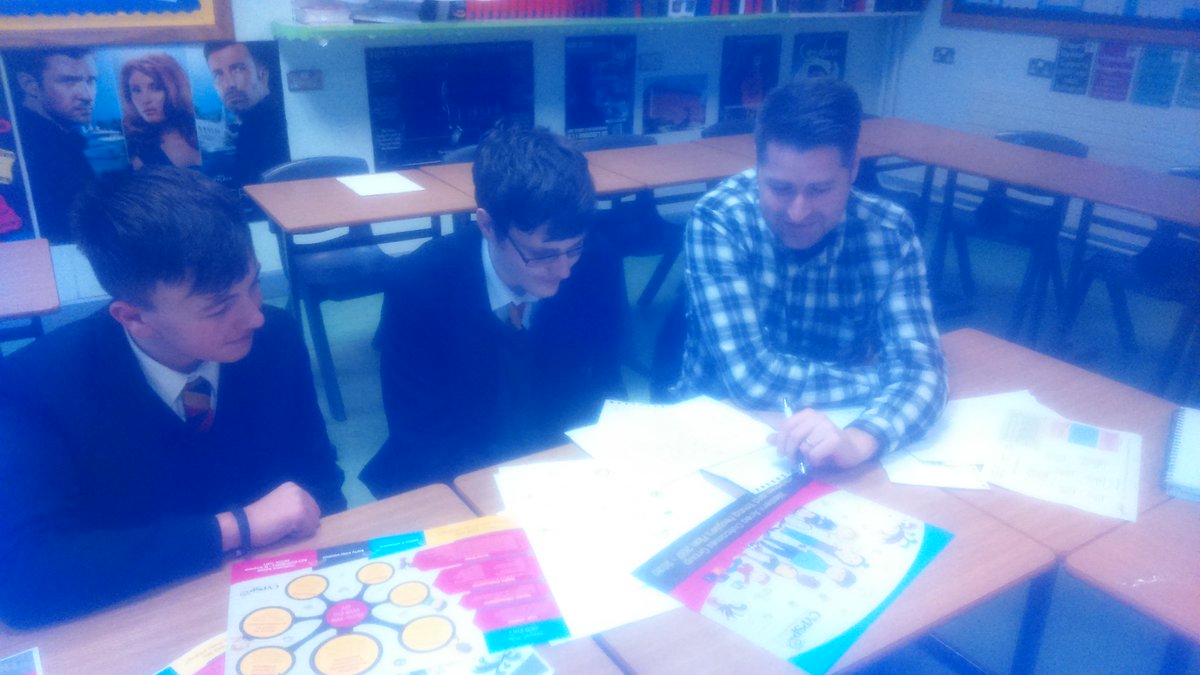 ENG_StJosephs's tweet photo. Year 11 boys consulting with Gareth McAlinden (Lermagh Graphics) on a new leaflet for CYPSY. Coming up with some great ideas.#CYPSY https://t.co/CWb22R0icC