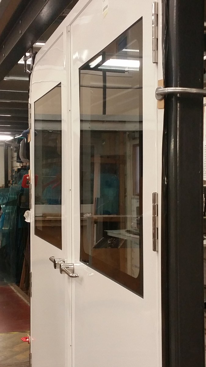 SeaglazeMarine's tweet photo. A Series 24 dogged door with flush windows as seen on the @redjet 6 #ferry to the IOW.#marinewindow  #flushwindow #doordesign https://t.co/idHlIvOLCB