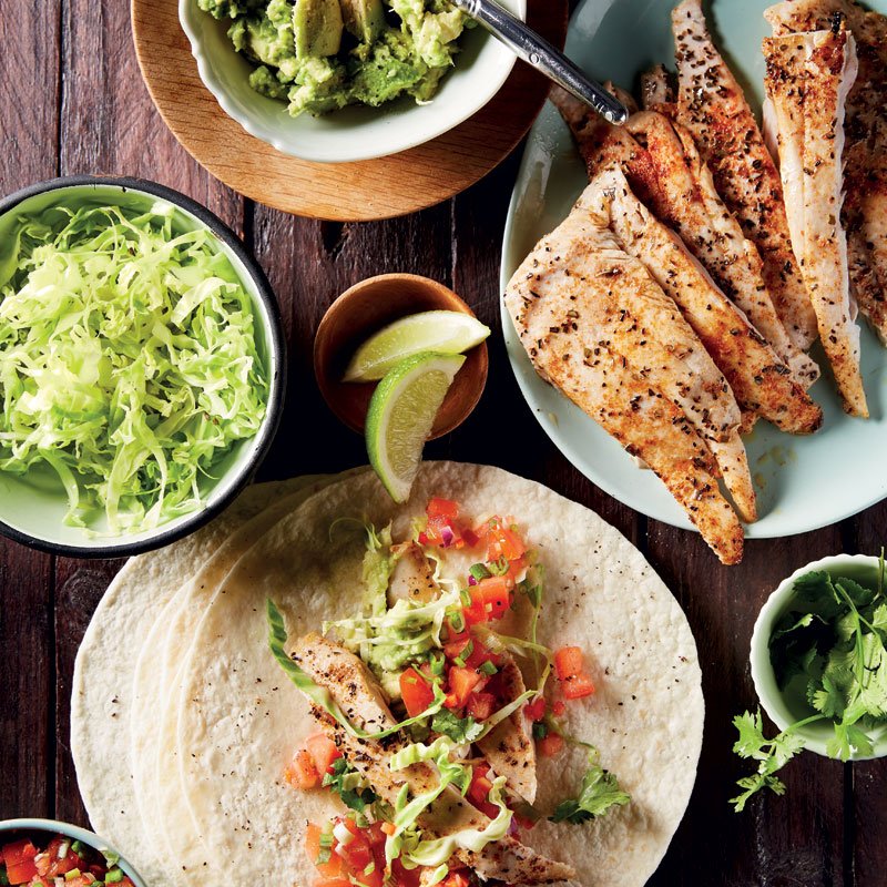 Fish tacos with smashed avocado and tomato salsa. taste.co.za/recipes/fish-t…