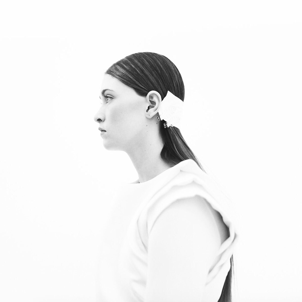 White rose tri-shoulder structure. Photography by Amina Gingold. #nyfw