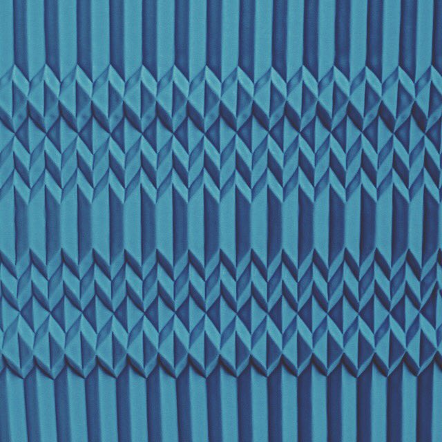 #Geometric folded fabric pattern...