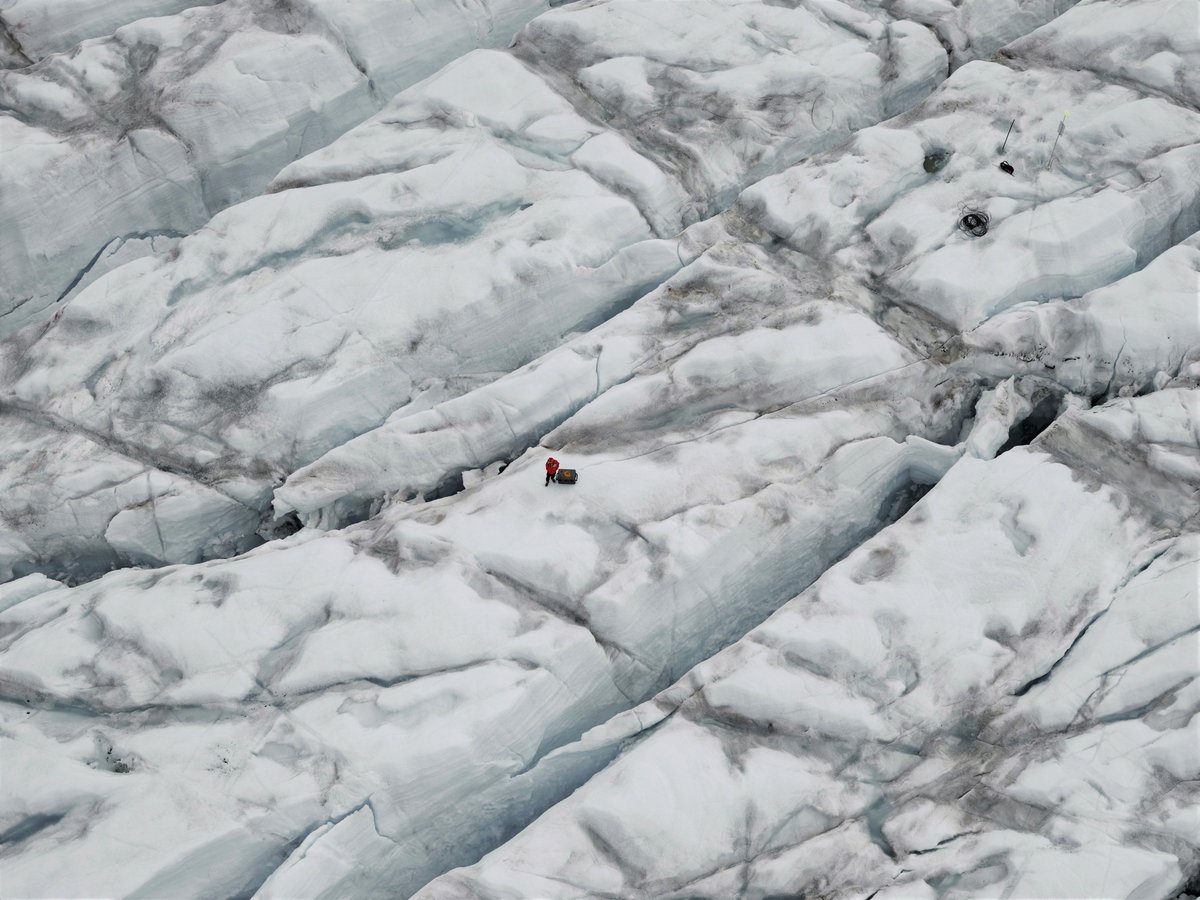 thaw2017's tweet photo. Alun Hubbard @AberUni at the #SAFIRE research camp, retrieving a sensor that was placed in a glacier. These crevasses are seriously deep! https://t.co/hnipgTPZTg