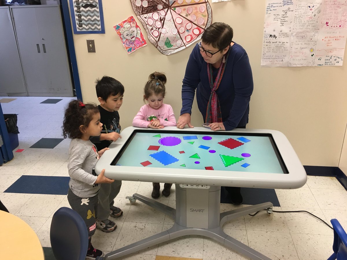 Mrs. Taylor, <a href="/MPS_Waddell/">Waddell Elementary</a> Numeracy Coach, shares the Smart Table with the Waddell FRC preschool play group. So fun! #smarttech #smarttable