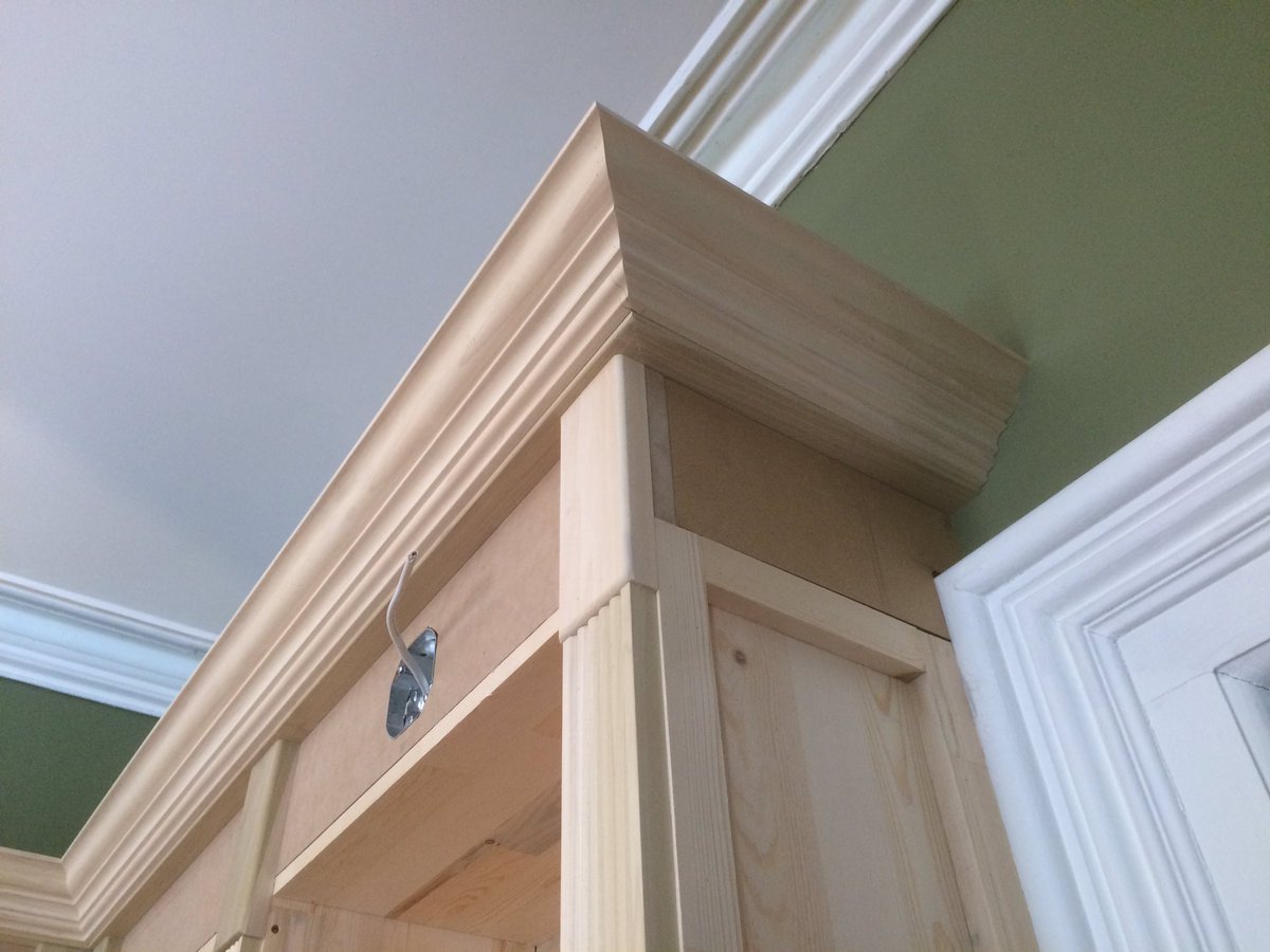 Progress with the bookcase.
3" fluted casing.
8" plinth blocks on top of casing.
5" crown moulding.