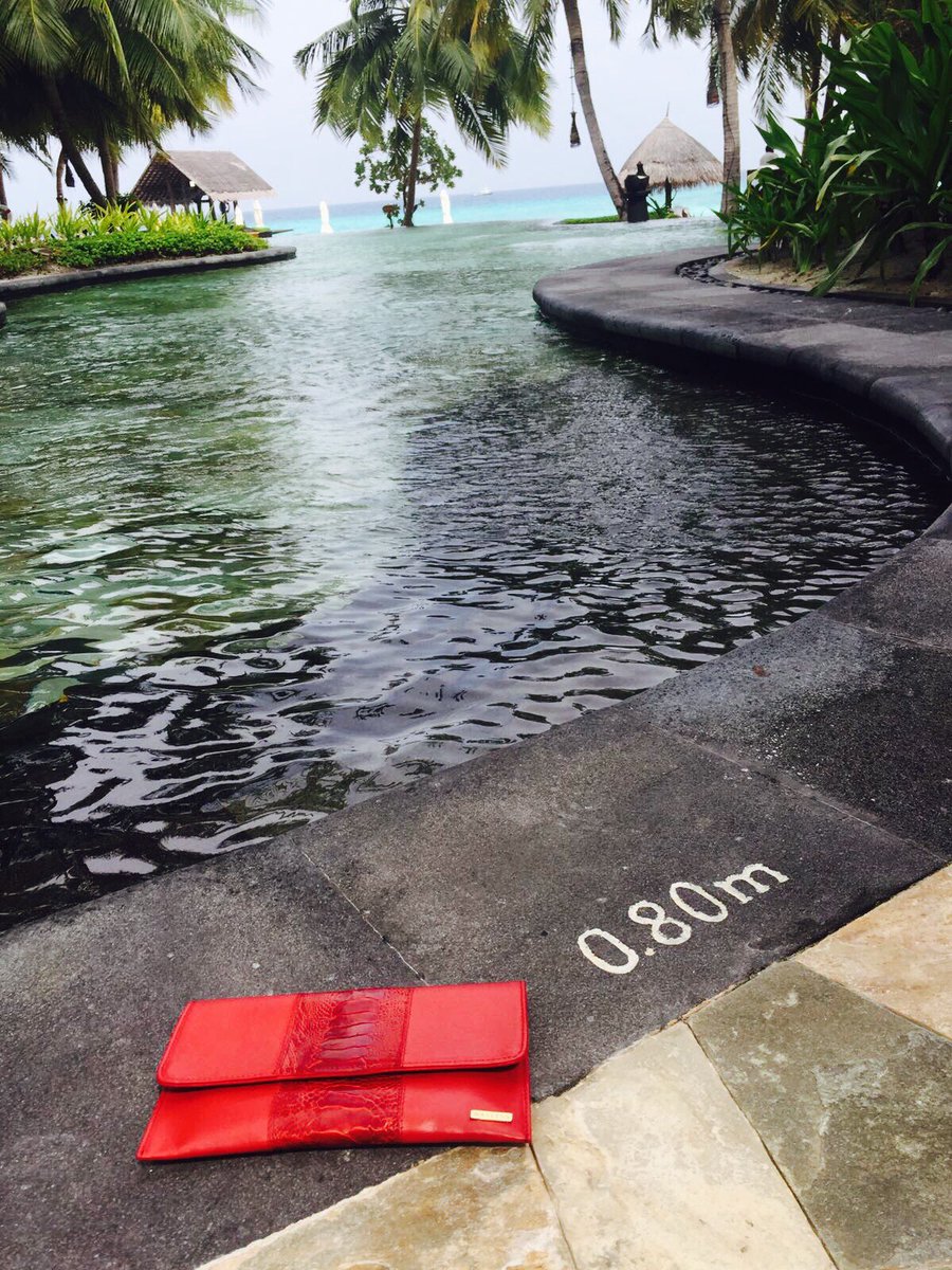nateiss's tweet photo. NATEISS flame red clutch sported by @Michaelafrankova in the Maldives.#LuxuryTravel #luxurybags  #ostrichleather #nateiss #clutch https://t.co/69kZegF5BZ