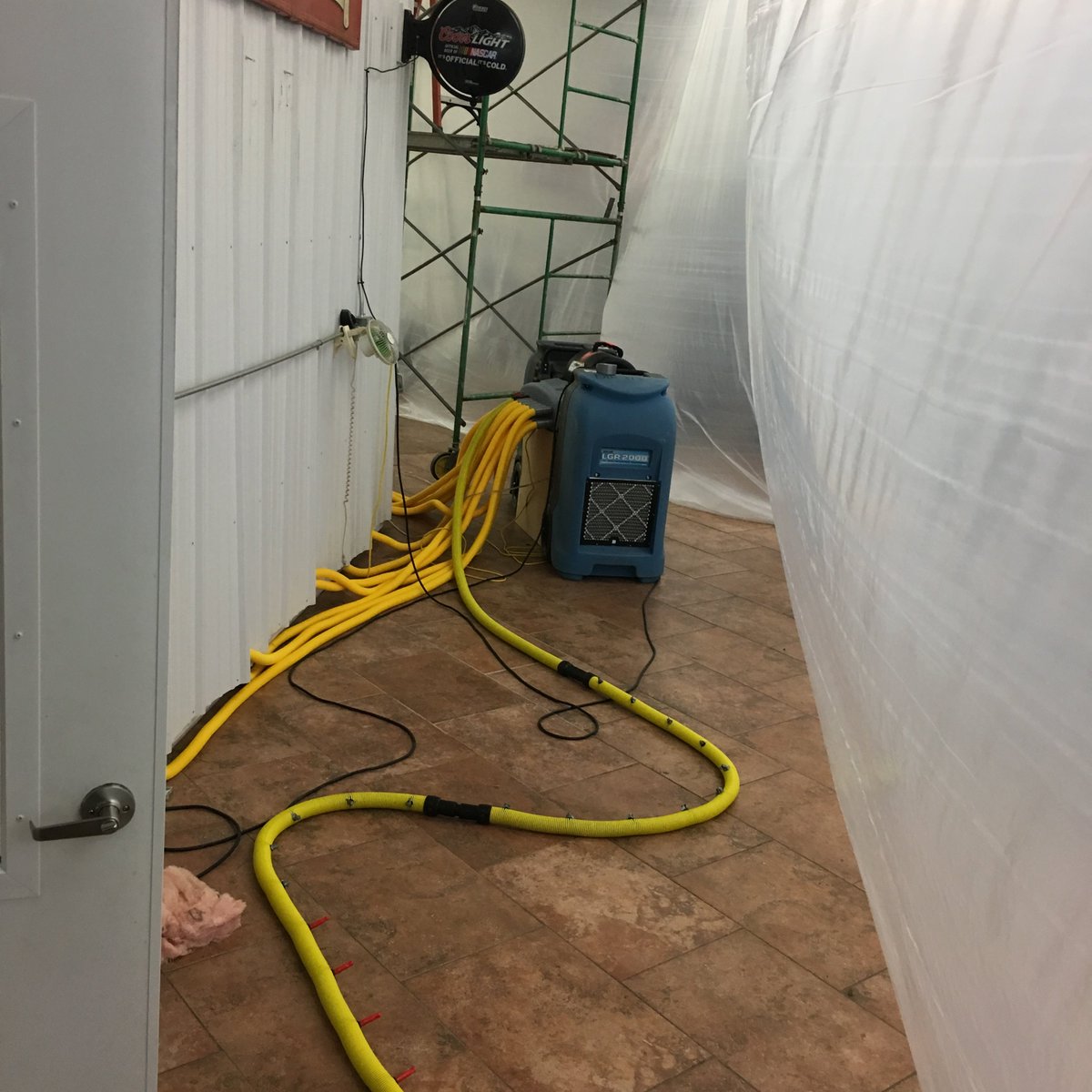 Saved this beautiful kitchen by injecting warm dry air into the toe kick of cabs and injecting the backside of warehouse wall.