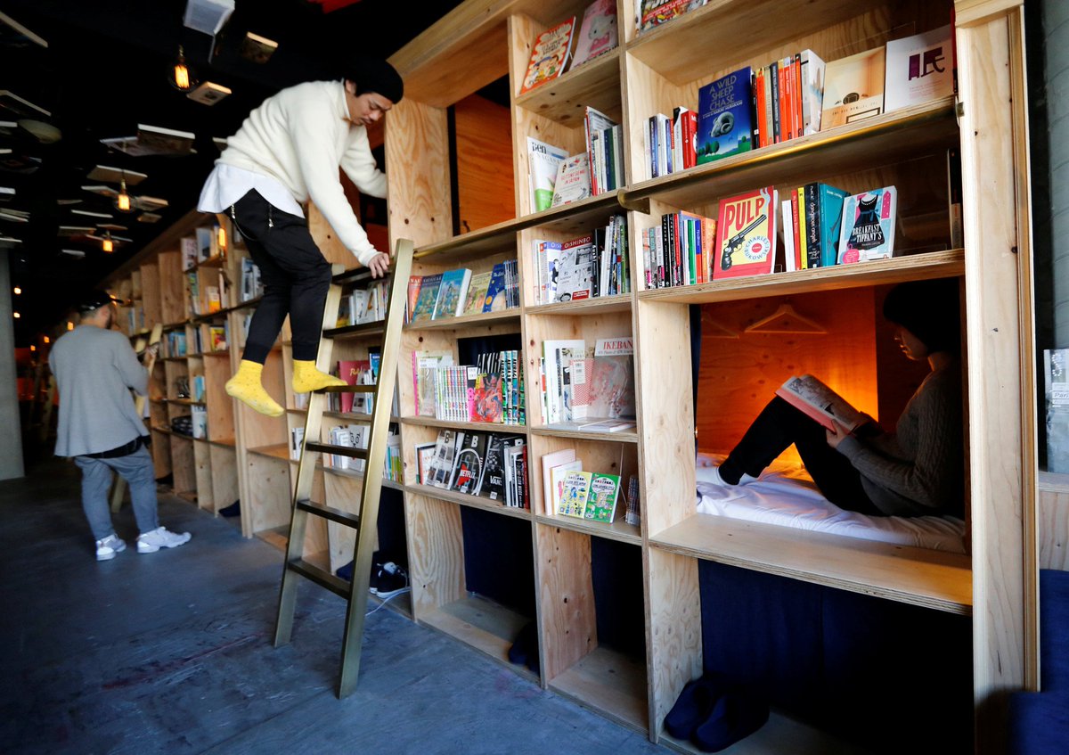 PDChina's tweet photo. Traveling bookworm’s heaven: bookstore-themed capsule hotels in Japan have beds constructed inside bookcases to doze you off while reading https://t.co/8u67Y0F3K7