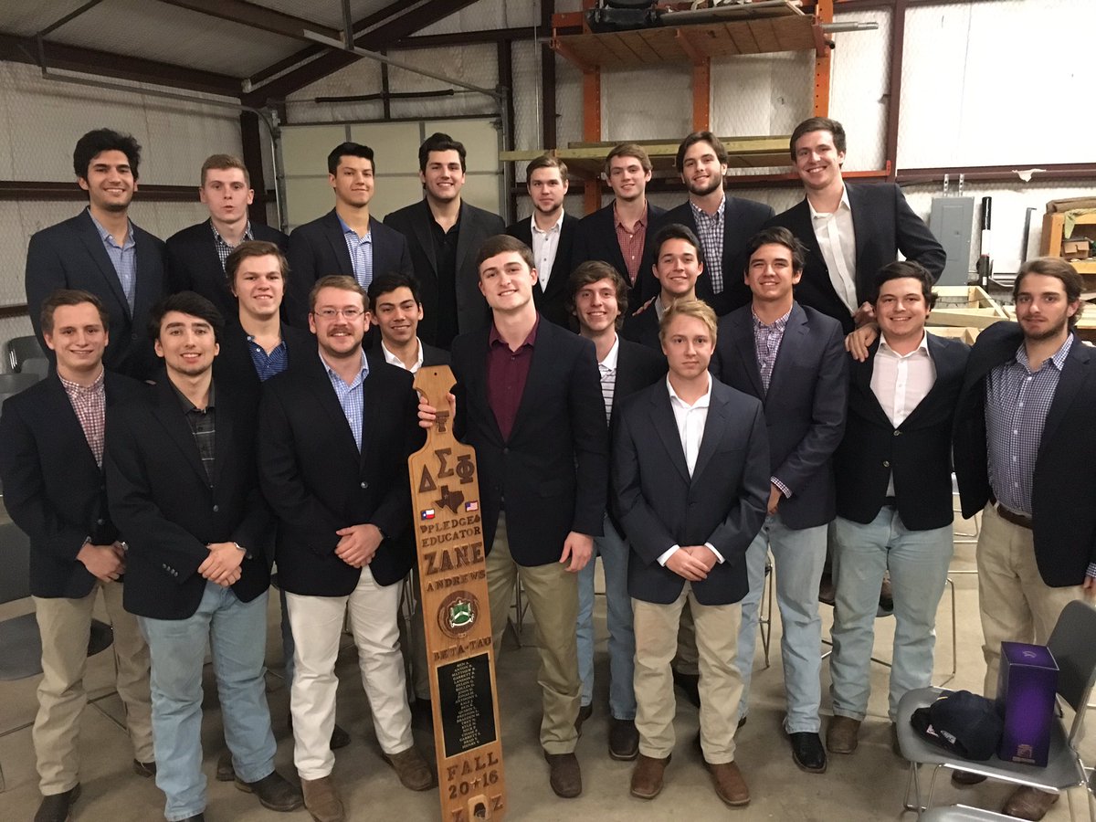 The Fall '16 pledge class Beta Tau presents Zane Andrews with his pledge ed paddle.