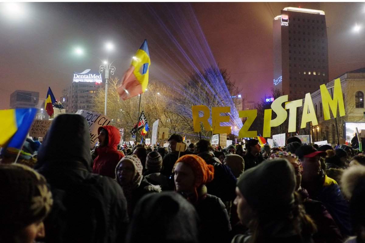 GreenpeaceRO's tweet photo. Sending a message to the people protesting to support democracy in #Romania - ”We #resist together” https://t.co/8Wat1x40EF
