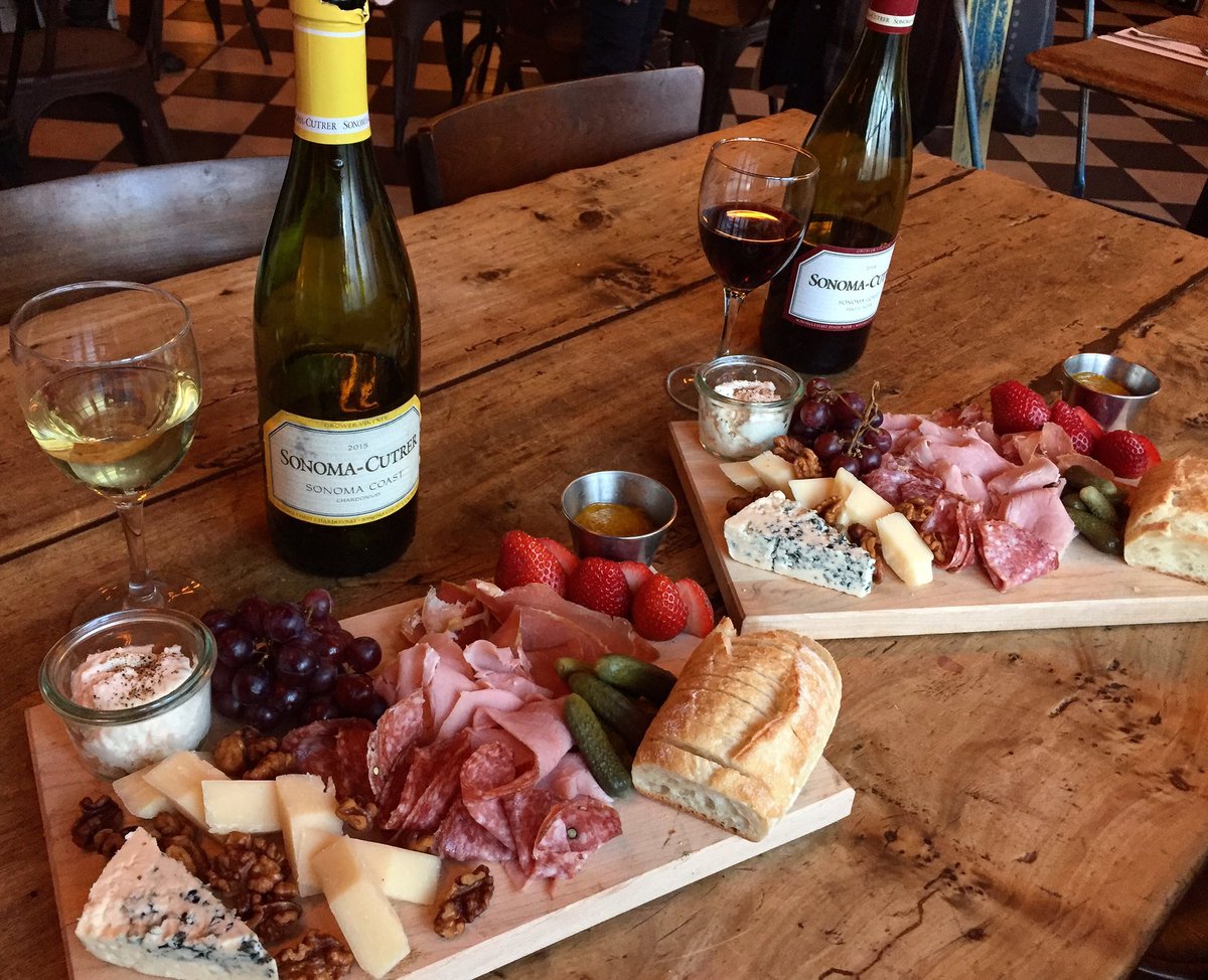 Charcuterie board for 2 available at happy hour Monday-Thursday 4:00-7:00 PM with two glasses of wine for forty bucks!