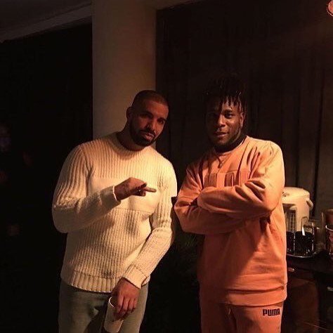 HarmattanRain's tweet photo. The King, @burnaboygram with a fan https://t.co/vyA3hkhhlg