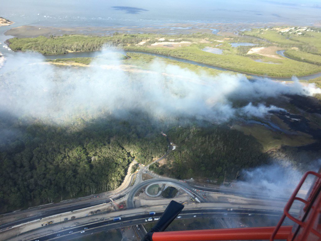 Large fire in the Boondall wetlands blowing smoke over the Gateway at Boondall #chopperview @QldFES 🔥💨 🚁