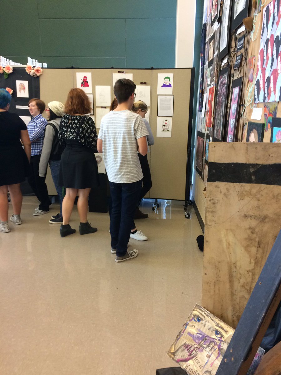 Some of our visitors getting invested in our wonderful students' displays