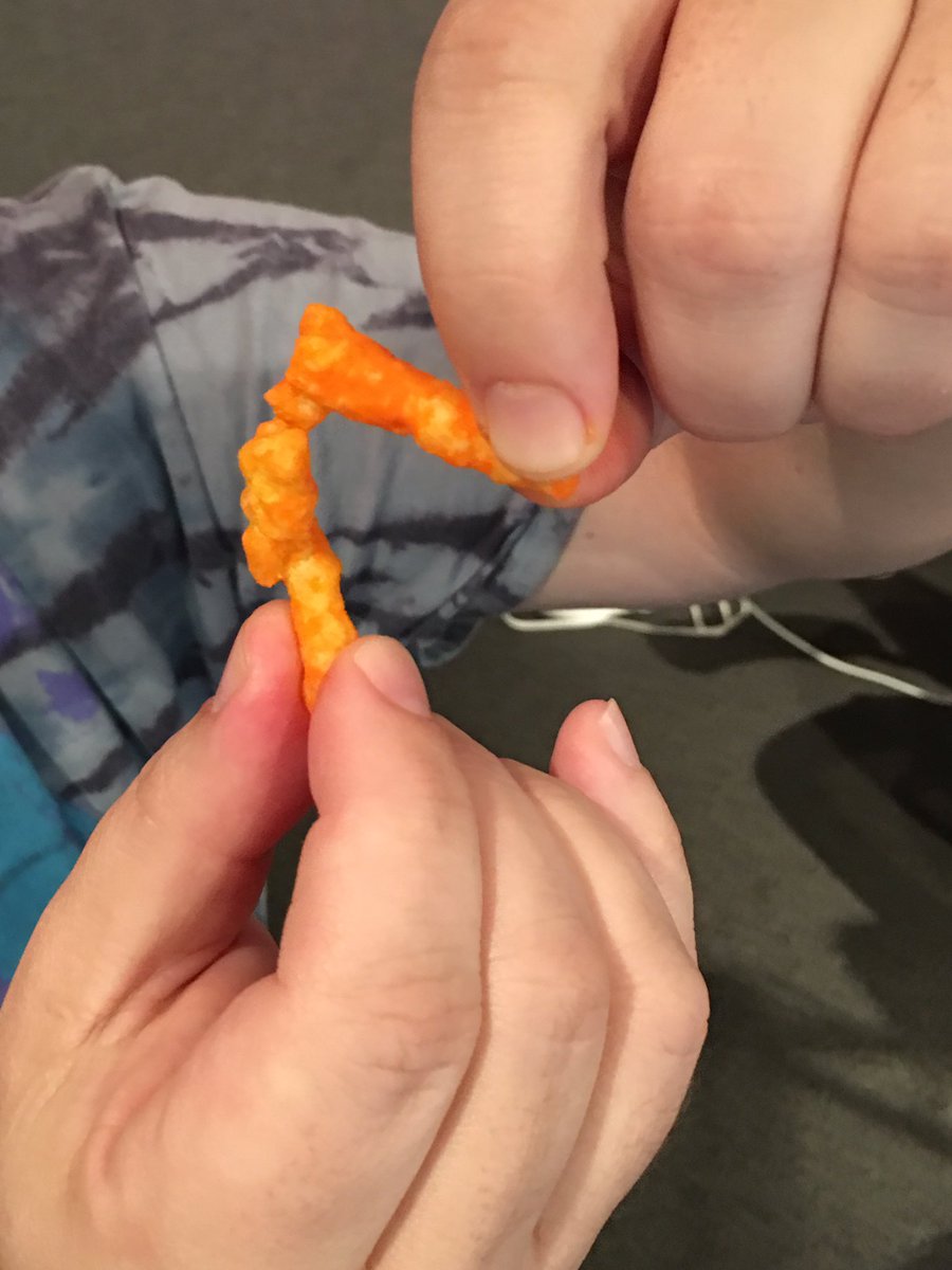 Here's 2 Cheetos I found in the shape of Charles Oakley choking a security guard. Bidding starts at 250K.