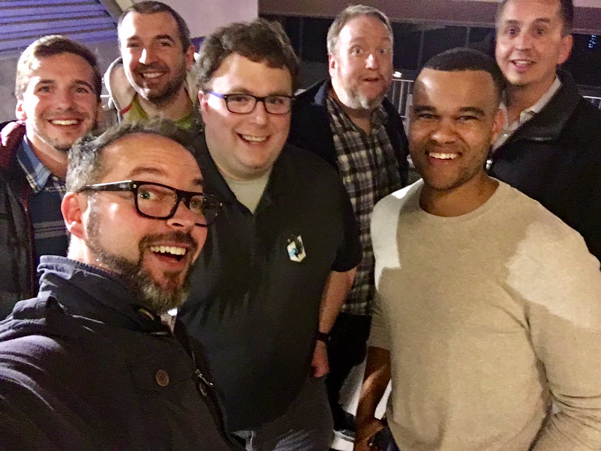 7 guys from the camp smiling for a selfie