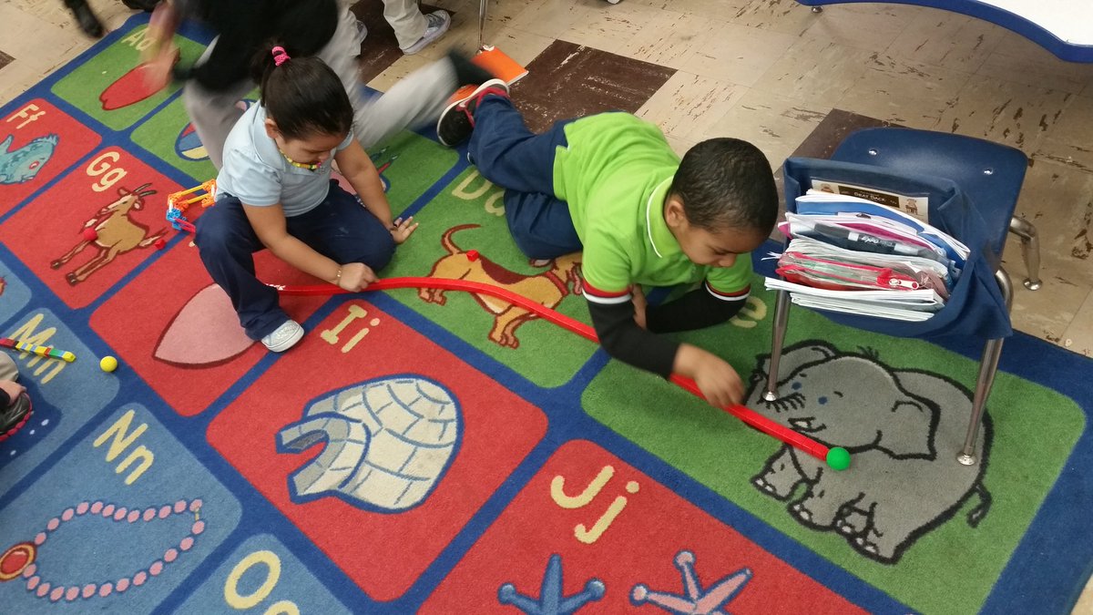 MrsLousClass's tweet photo. Using our ramps and measuring how far out ball rolled with cubes as our tool! #science #pushpullgo #kindergartenrocks @baltzprincipal https://t.co/qy92dGjwnG